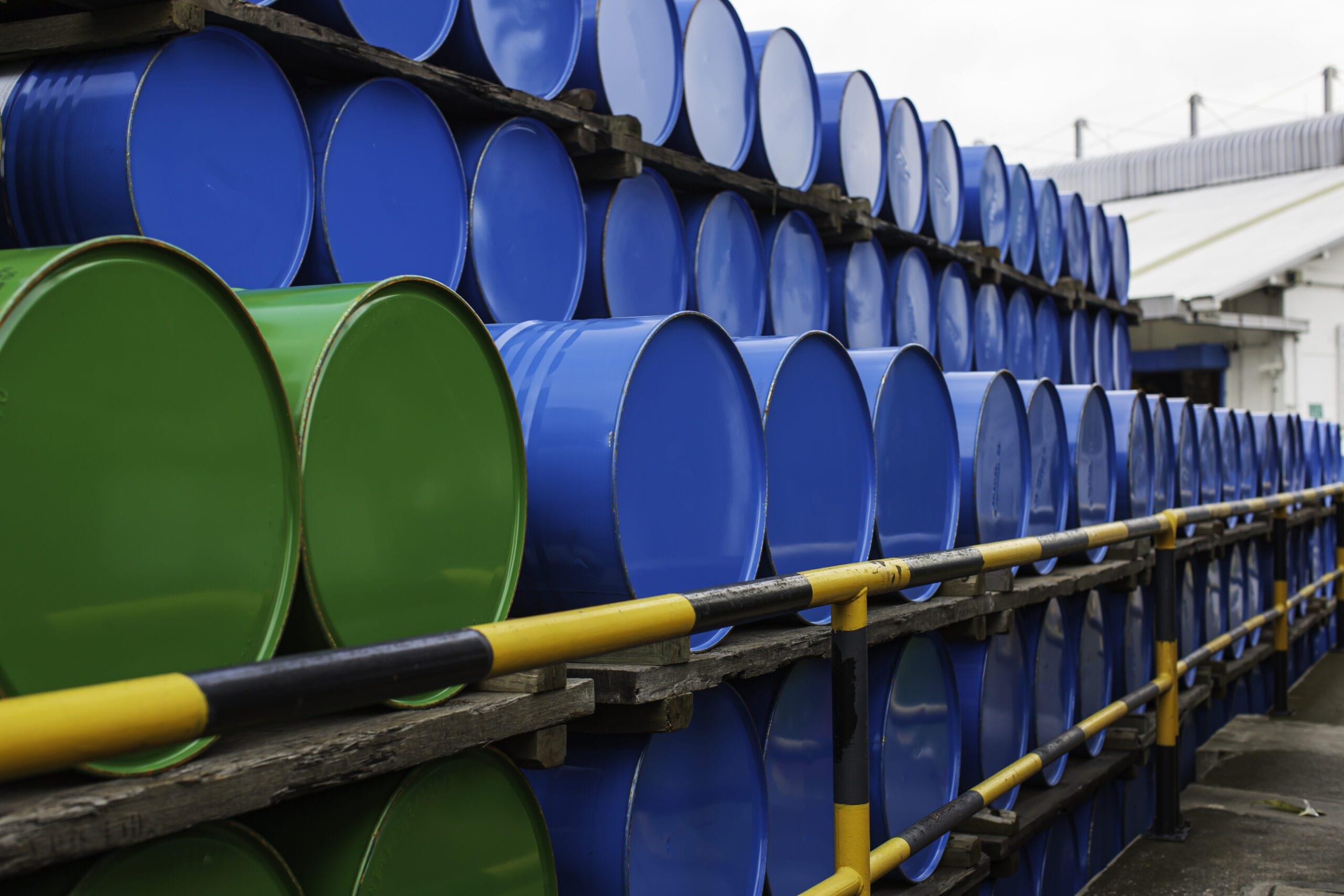 Oil barrels blue and green or chemical drums horizontal